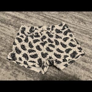 H&M white short shorts with black leaf print. Size 4.